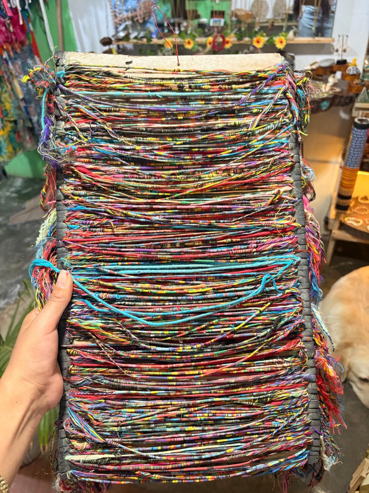 A close view of colorful threads prepared for weaving